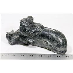 ESKIMO RIDING A WHALE SOAPSTONE.