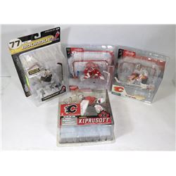LOT OF 4 ASST NHL TEAM PLAYER FIGURES.
