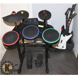 LOT OF 2 GUITAR HERO DRUMSETS AND 3 GUITARS