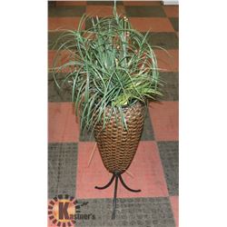 ARTIFICIAL PLANT IN WICKER POT.