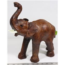 VINTAGE LEATHER WRAPPED GLASS EYE TUSKED ELEPHANT.