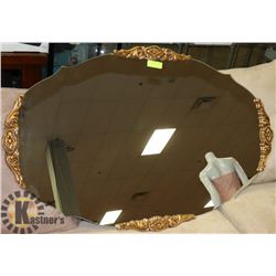 LARGE OVAL WALL MIRROR.