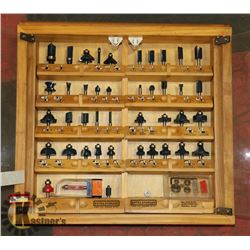 ROUTER BITS IN WOOD AND GLASS CASE.