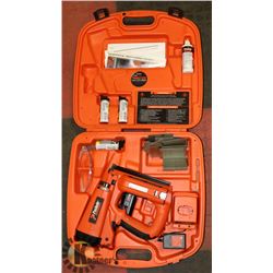 PASLODE NAILER IN ORANGE CASE.