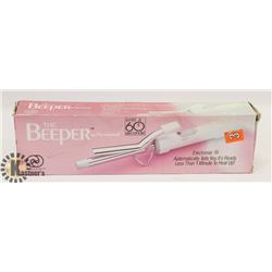 THE BEEPER CURLING IRON.