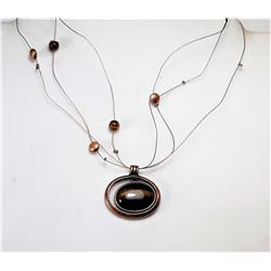 17) COPPER & TIGER'S EYE FLOATING
