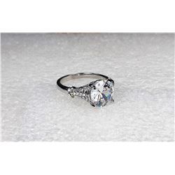 14)  WHITE TOPAZ SOLITAIRE RING WITH