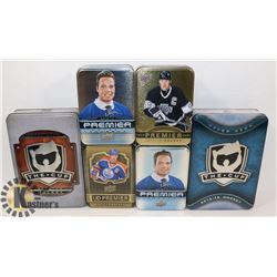 BOX OF HOCKEY TINS.