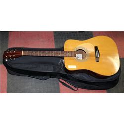 TARA ACOUSTIC GUITAR IN A LEVYS LEATHER LTD CASE.