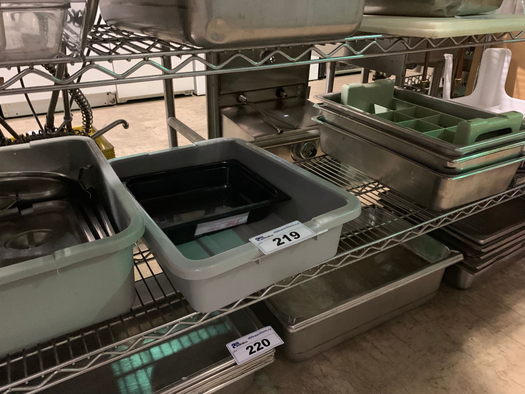 SHELF OF BUS BINS, COVERS, UTENSIL DISH RACK, STEP STOOL, AND WARMING TRAYS