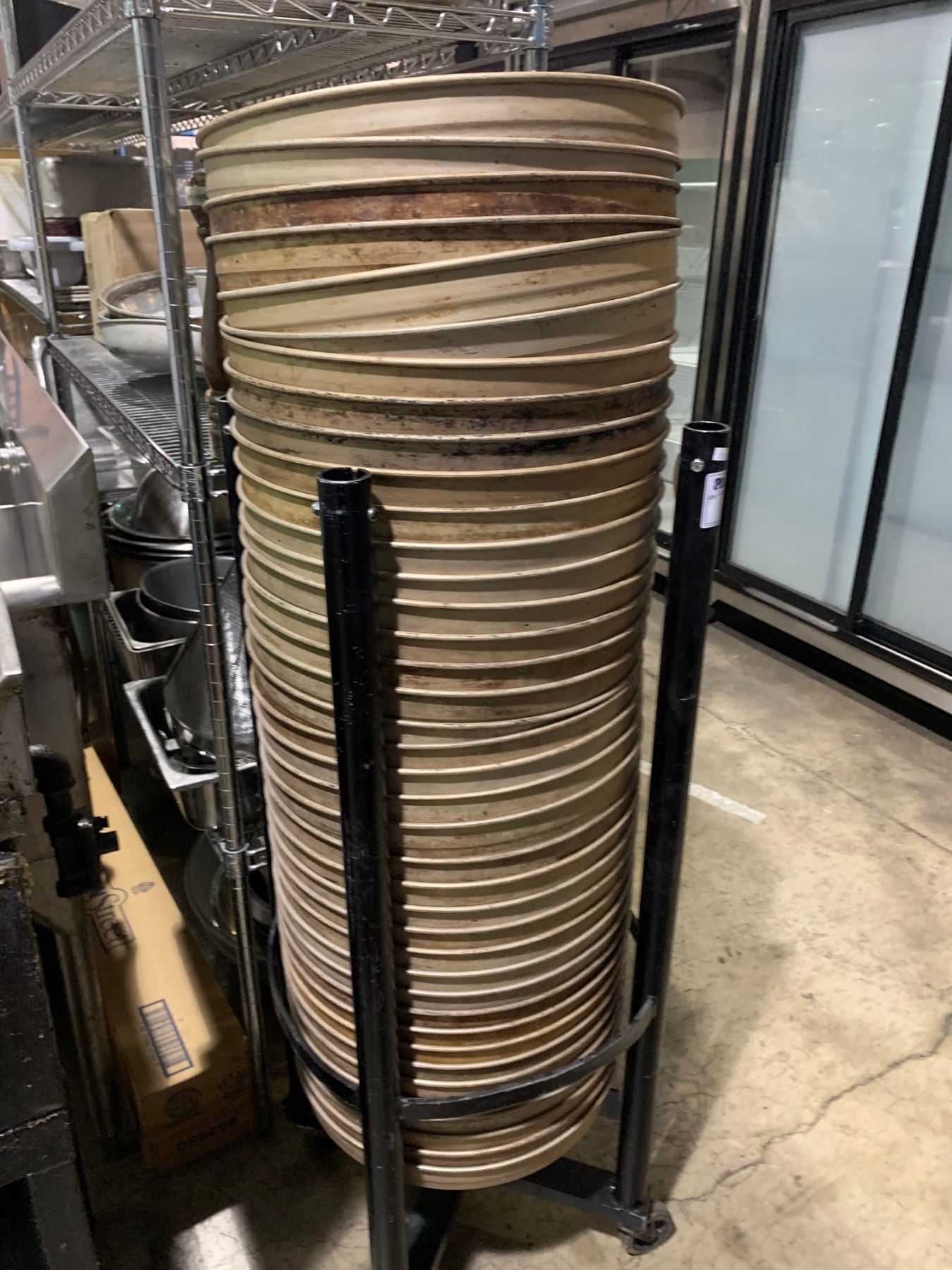 SPRING LOADED RACK WITH APPROX 40 PIZZA PANS - Able Auctions