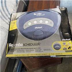 ROOMBA SCHEDULER VACUUMING ROBOT 2.1, NEEDS POWER SUPPLY FOR CHARGER