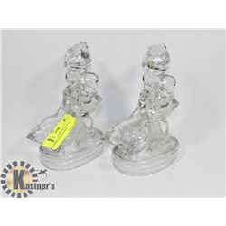 PAIR OF GLASS BOOKENDS OF A WOMAN FEEDING GEESE.