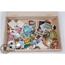 CIGAR FOX FILLED WITH PINS, TOKENS AND STAMPS.