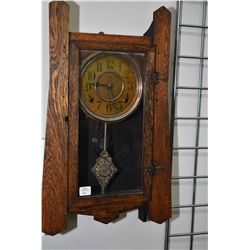 Antique mission style wall mount chiming clock with decorative visual pendulum, working at time of c