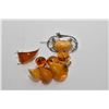 Image 1 : Three amber brooches including Baltic amber and gold plate brooch, Nouveau style silver brooch, and 