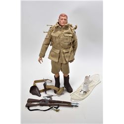 Vintage G.I. Joe action figure patented 1964 with accessories including snow shoes and boots, two ri