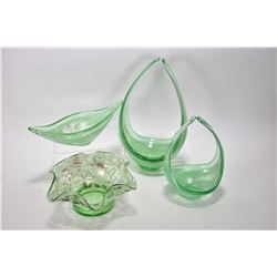 Four pieces of art glass including two graduated pieces, boat shaped dish and a ruffled dish, all be