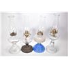 Image 1 : Four vintage oil lamps including three colourless including one with metal base and a milk glass wit