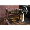 Image 2 : Antique Eaton treadle sewing machine in fully enclosed oak cabinet