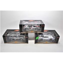 Three new in box 1:18 scale Maisto die cast collector cars including Audi R8R, Audi R8 and a Porsche