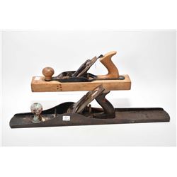 Two wood planes including a Stanley No.8 and an unmarked wood plane