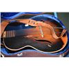 Image 3 : Two vintage musical instruments including a Melody King six string guitar in hard case and a violin