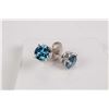 Image 1 : Pair of 14kt white gold and blue diamond stud earrings. Set with 1.06cts of round brilliant cut blue