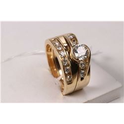 Ladies 14kt yellow gold and diamond engagement and soldered wedding rings. Engagement ring is set wi