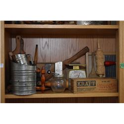 Shelf lot of vintage kitchen collectibles including glass butter churn, small mixer, scales, rolling