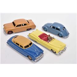 Four vintage Dinky Toys including Cadillac Eldorado # 131, Volkswagen # 181, Ford Sedan and a Hudson