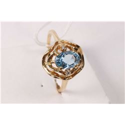 14kt yellow gold ring set with oval faceted aquamarine gemstone