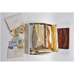 Selection of assorted collectible stamps and a stamp book