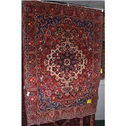 100% wool Iranian Bakhtiar area carpet with large center medallion with predominantly red background