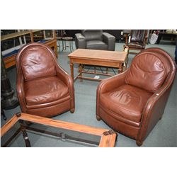 Pair of modern leather arm chairs with naihead decoration made by Elite for Finesse Furnishings