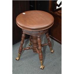 Antique adjustable piano stool with cast and glass ball and claw feet