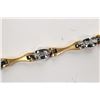 Image 1 : Ladies 18kt yellow and white gold diamond bracelet set with .33ct of round full cut white diamonds. 