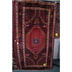 100% wool Iranian Nahavand area carpet with large center medallion, in tones of red, royal navy blue