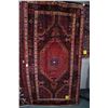 Image 1 : 100% wool Iranian Nahavand area carpet with large center medallion, in tones of red, royal navy blue