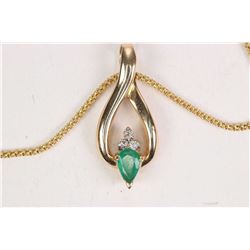 10kt yellow gold 18 1/2  neck chain with a 14kt yellow gold, emerald and diamond pendant set with 0.