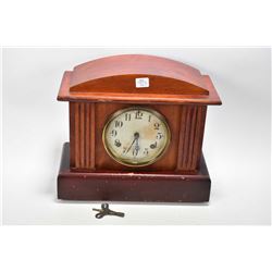 Antique chiming wood cased mantle clock made by Waterbury Clock Co. U.S.A, working at time of catalo