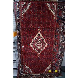 100% wool Iranian Hosseinabad area carpet with center medallion, red background, highlights of royal