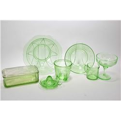 Selection of vintage uranium glass including two measuring cups, two serving bowls, lidded refrigera