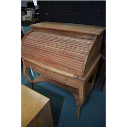 Antique roll top desk with pull out writing surface and single drawer, had been stripped and is read