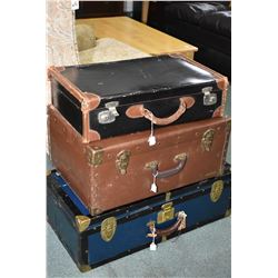 Three vintage suitcases including steamer style