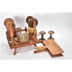 Selection of wool accessories including wool spool stand, plus two empty spools and a pair of carder