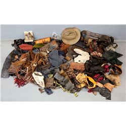 Quantity of production costume accessories, predominantly belts, hats and gloves.