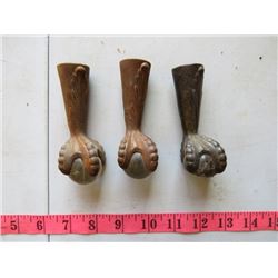 THREE METAL CLAW FEET WITH GLASS