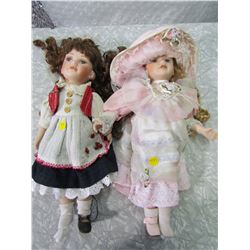 PAIR OF PORCELAIN DOLLS