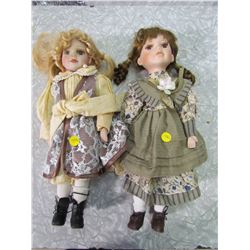 PAIR OF PORCELAIN DOLLS